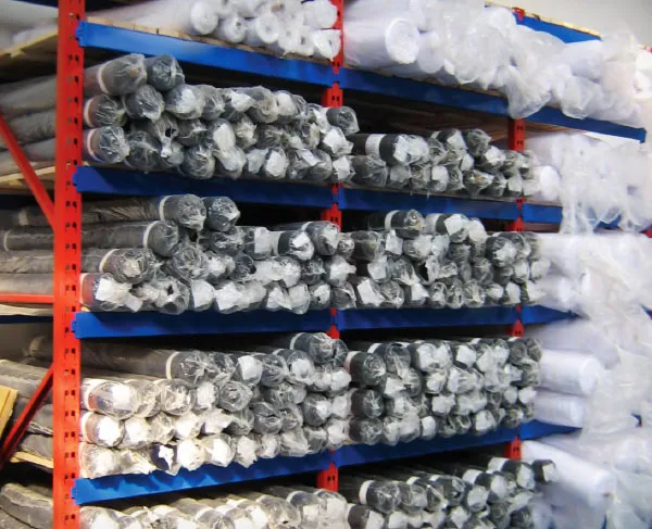 Light duty shelving storing rolled fabric stock